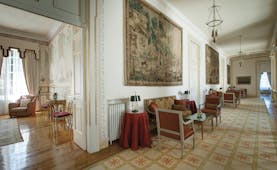 Tivoli Palacio de Seteais Portugal lobby large hallway with tapestry sofas and coffee tables