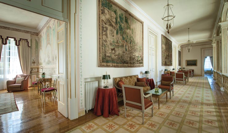 Tivoli Palacio de Seteais Portugal lobby large hallway with tapestry sofas and coffee tables