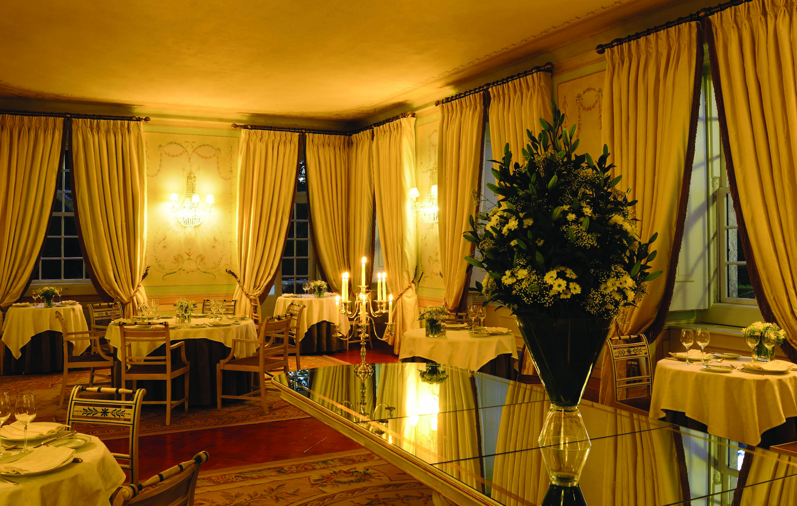 Tivoli Palacio de Seteais Portugal restaurant night large dining area with archway with draped curtains