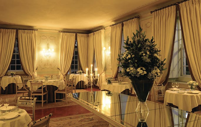 Tivoli Palacio de Seteais Portugal restaurant night large dining area with archway with draped curtains