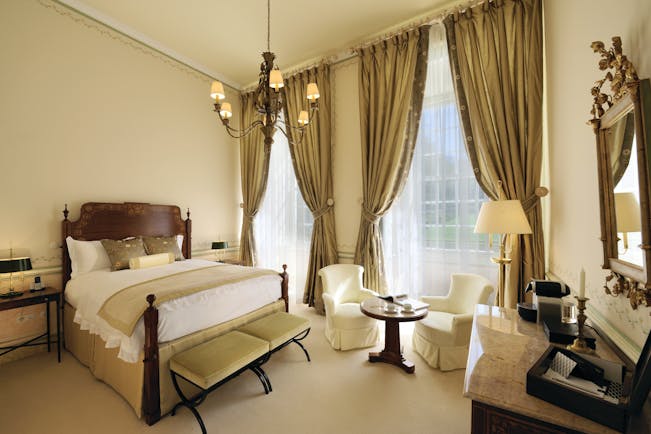 Tivoli Palacio de Seteais Portugal superior double bedroom with large windows and draped curtains and chairs and desk