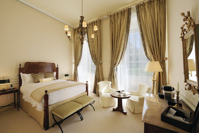 Tivoli Palacio de Seteais Portugal superior double bedroom with large windows and draped curtains and chairs and desk