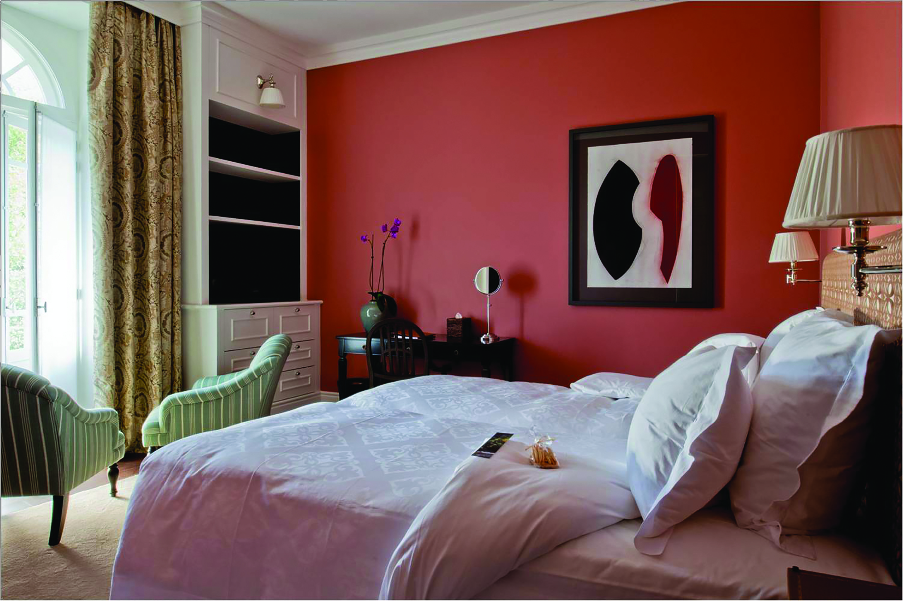 Vidago Palace Portugal superior bedroom with red walls and large window