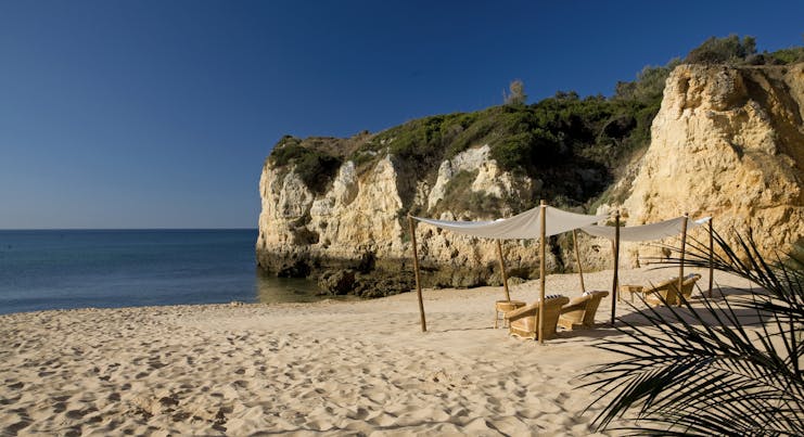 Vila Vita Parc Portugal beach cove with cabana and armchairs