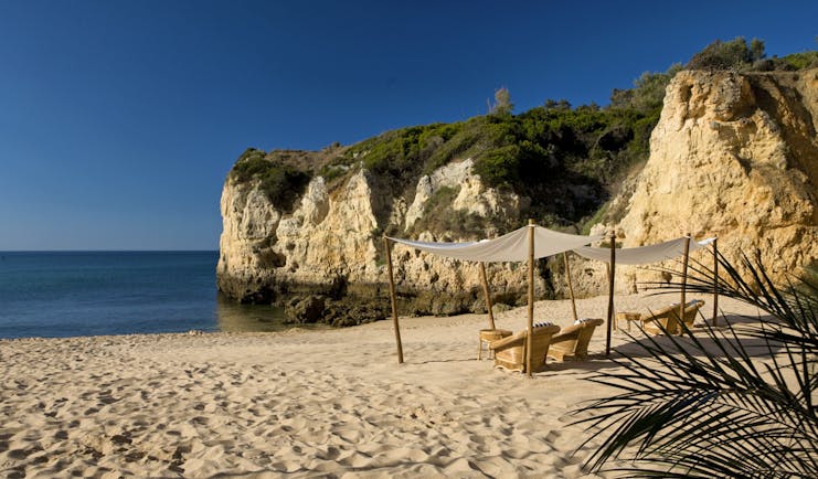 Vila Vita Parc Portugal beach cove with cabana and armchairs