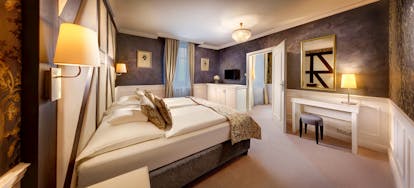 Grandhotel Stary Smokovec deluxe room, twin beds, comfortable modern decor with wooden accents, ensuite