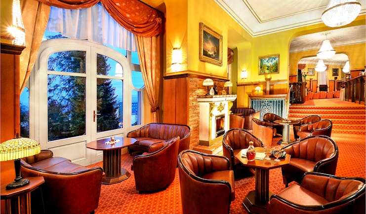 Grandhotel Stary Smokovec lobby, leather armchairs, open fire, grand traditonal decor 