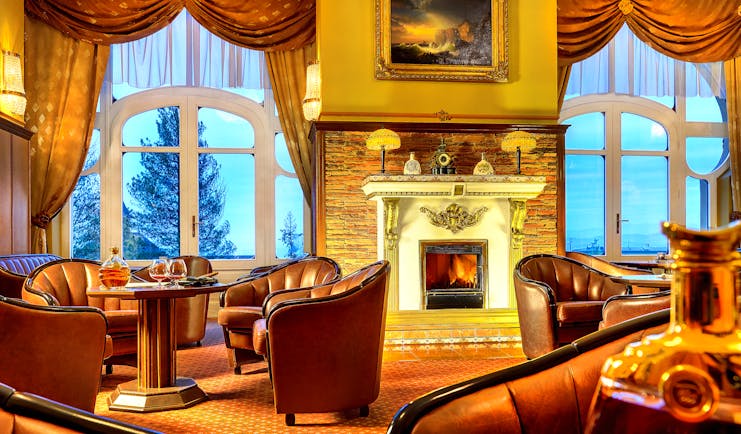 Grandhotel Stary Smokovec lounge, communal seating area, leather armchairs, open fire, grand traditonal decor