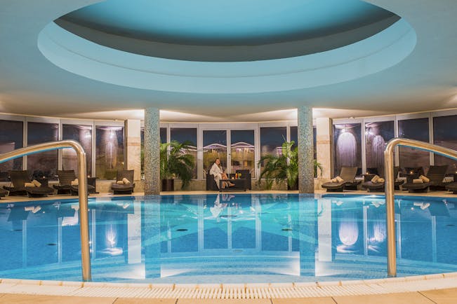 Grandhotel Stary Smokovec indoor pool, loungers, woman in dressing gown 