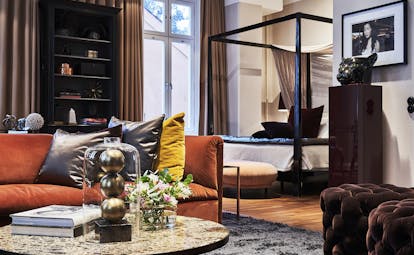 Hotel Lydmar street room, velvet sofa, modern four poster bed, eclectic decor 
