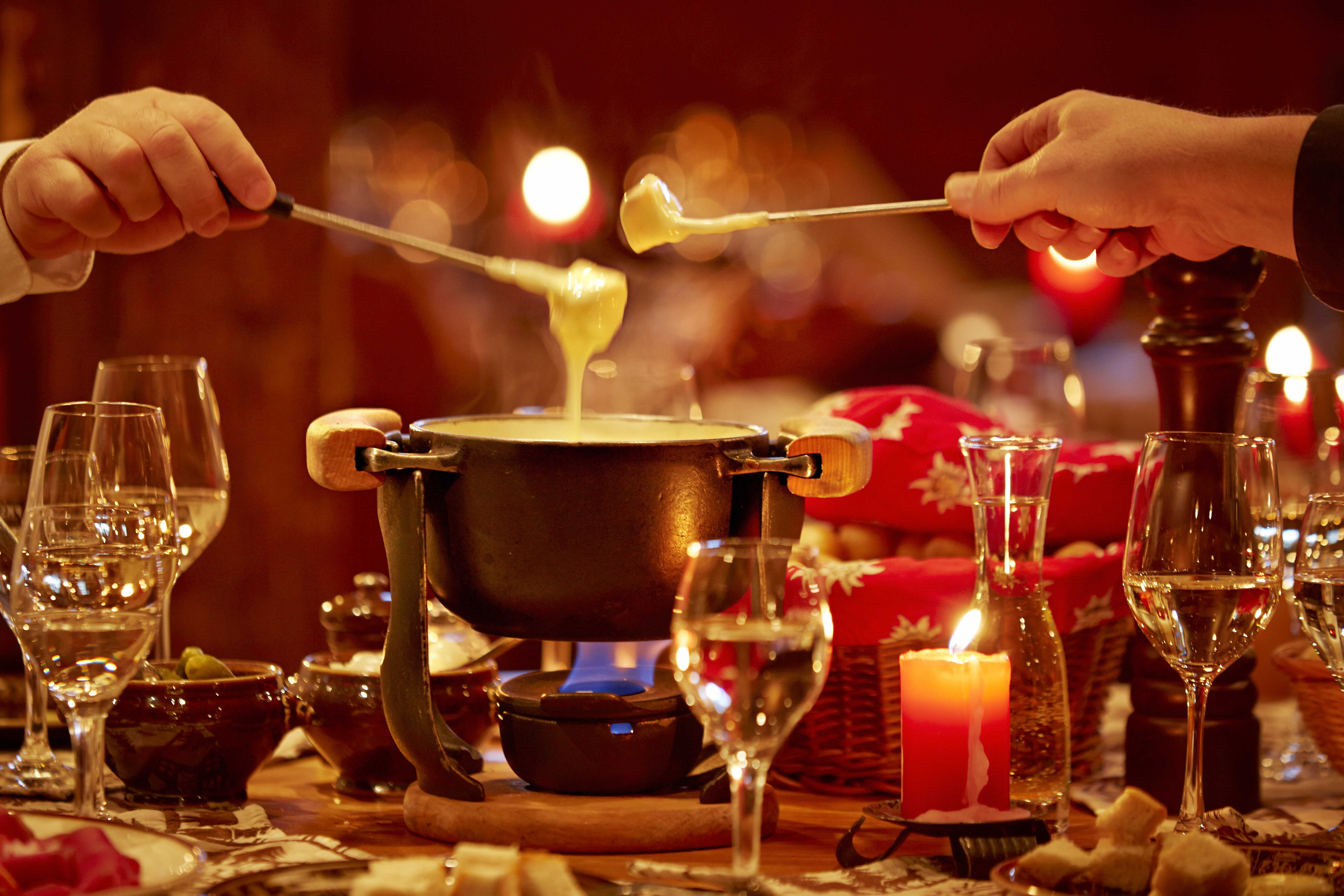 Gstaaderhof eating a cheese fondue by candlelight
