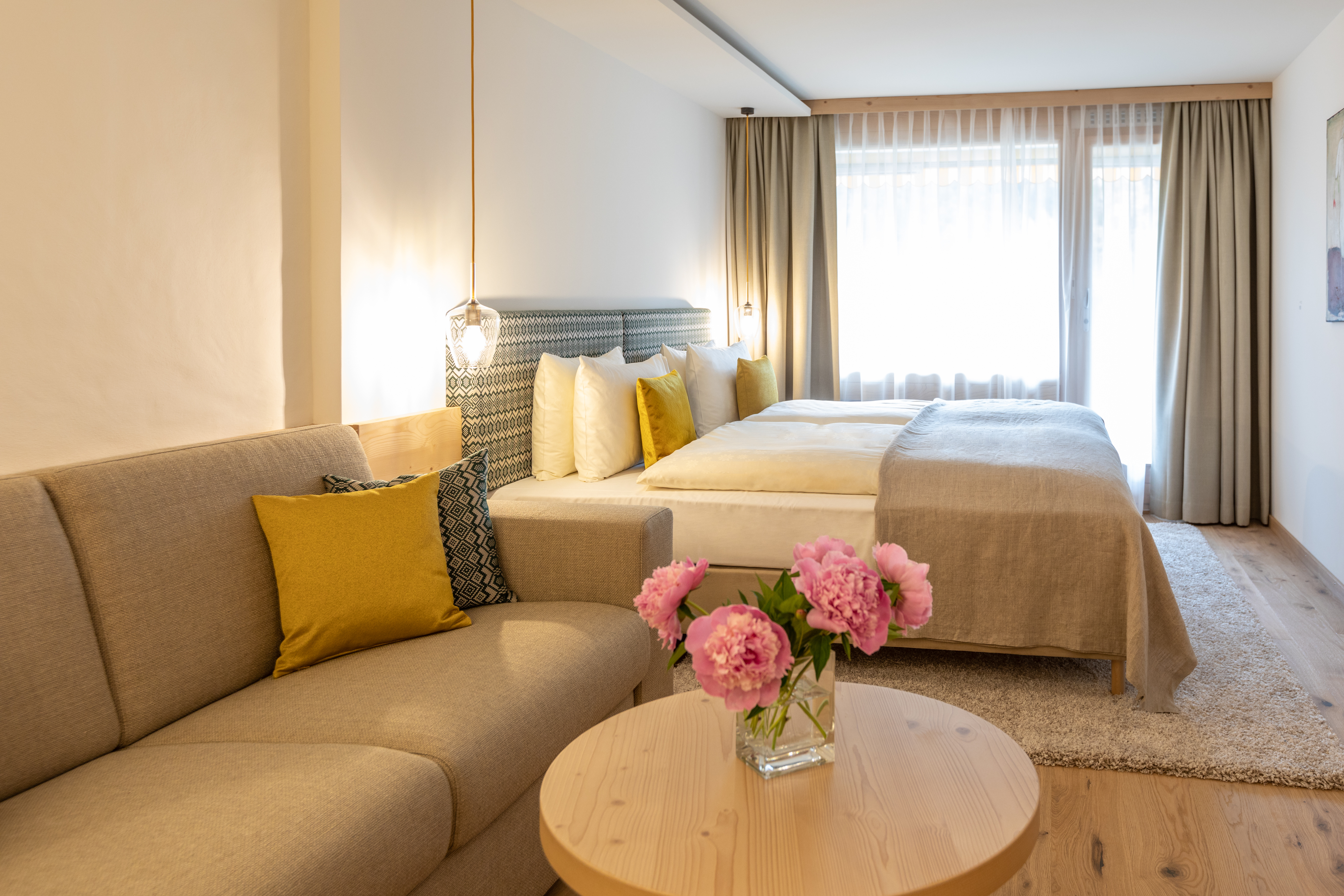 Gstaaderhof large pale bedroom with pink flowers