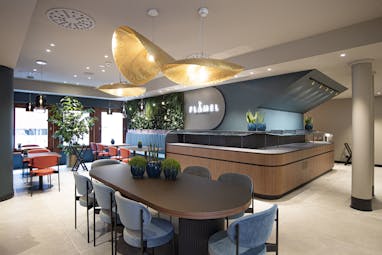 Hotel Lugano Dante Flamel bar, modern seating area, stylish light features, wooden curved bar