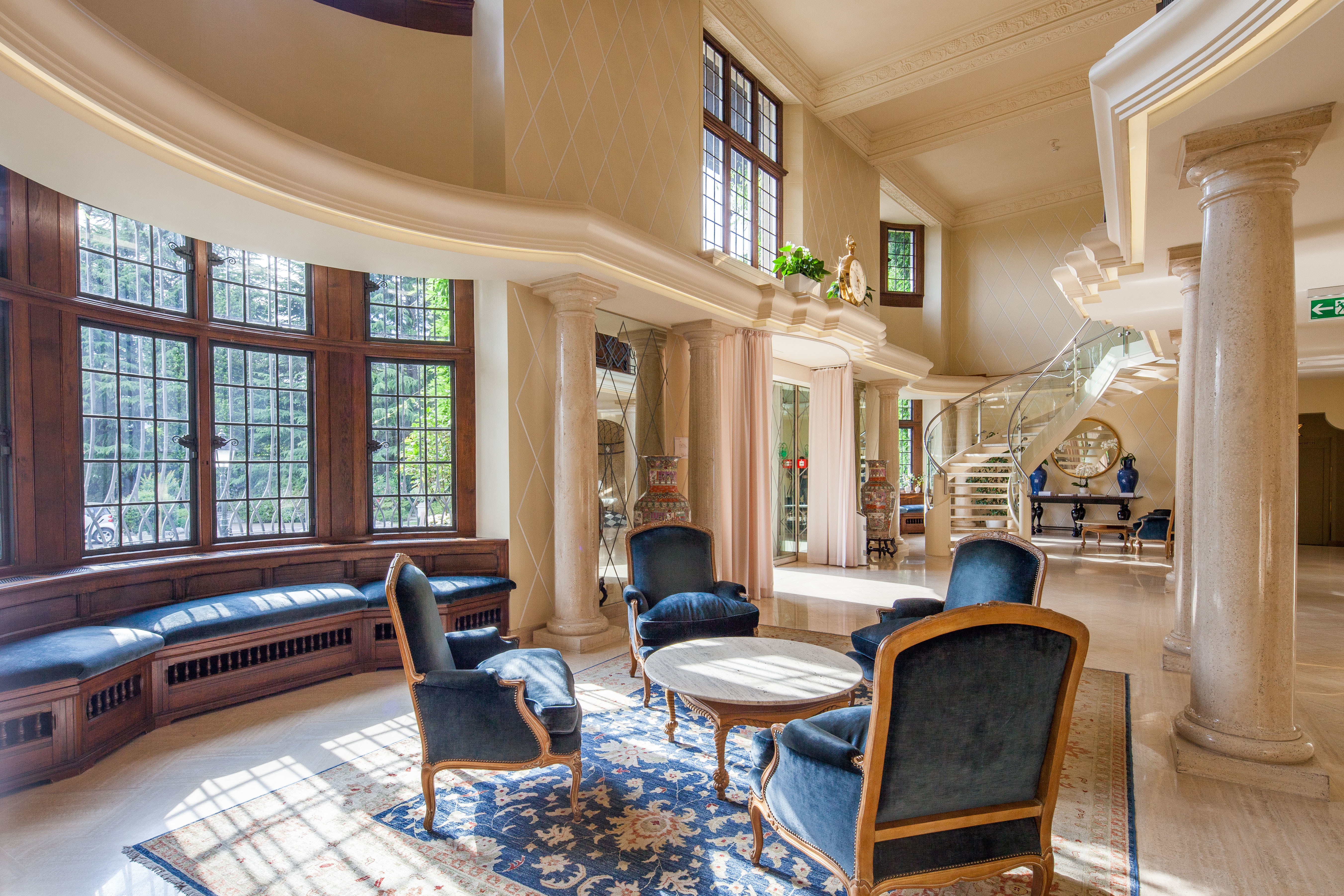 Villa Principe Leopoldo grand entrance hall with marble columns and blue seats