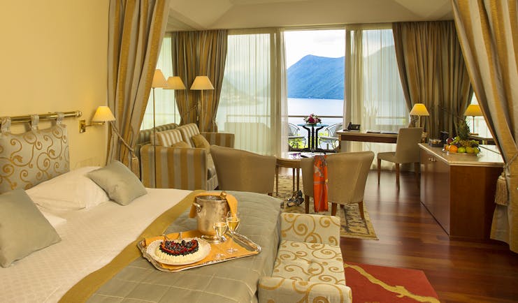 Villa Principe Leopoldo bedroom with lake view, and red carpet