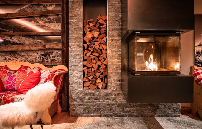 Romantik Hotel Julen Zermatt cosy chairs with open fireplace in lounge