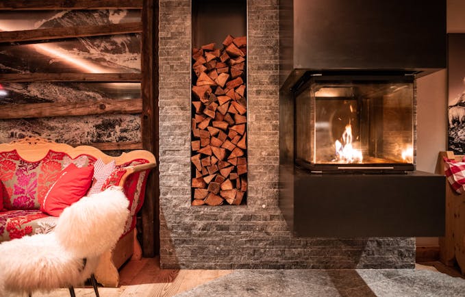Romantik Hotel Julen Zermatt cosy chairs with open fireplace in lounge