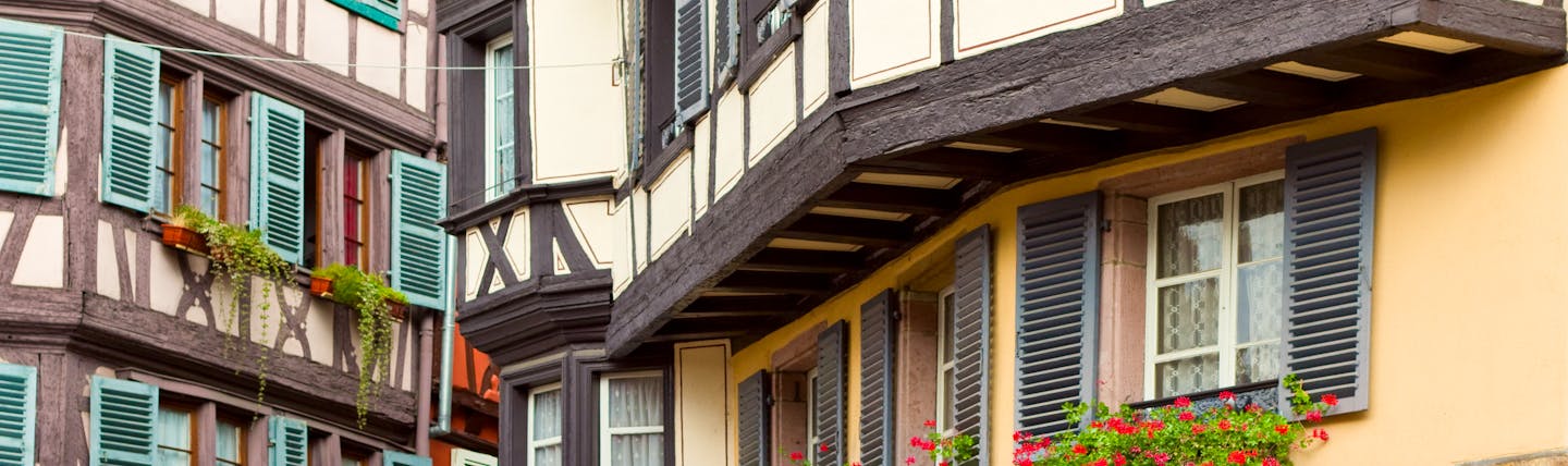Half timbered houses with green wooden shutters in Colmar Alsace