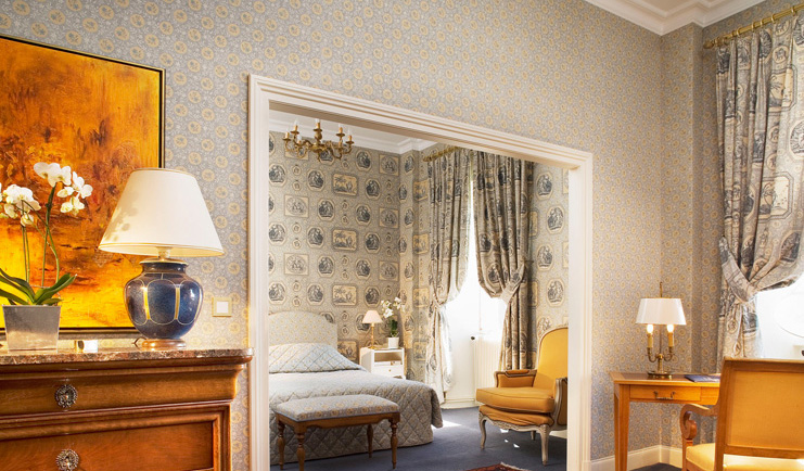 Chateau d'Isenbourg Alsace junior suite seating area with open archway to bedroom