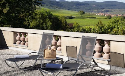 Chateau d'Isenbourg sun terrace with view of vines