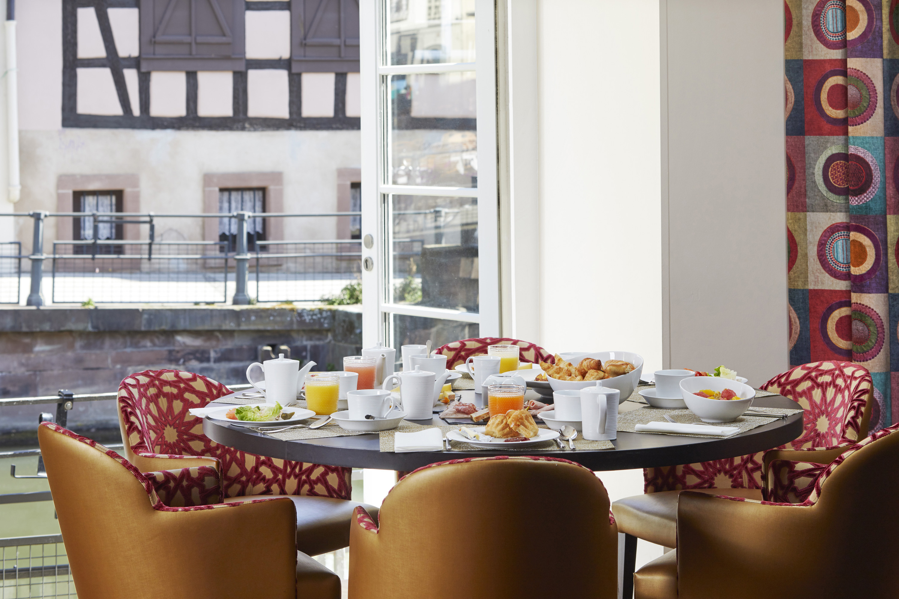 Breakfast table overlooking river at Regent Petite France