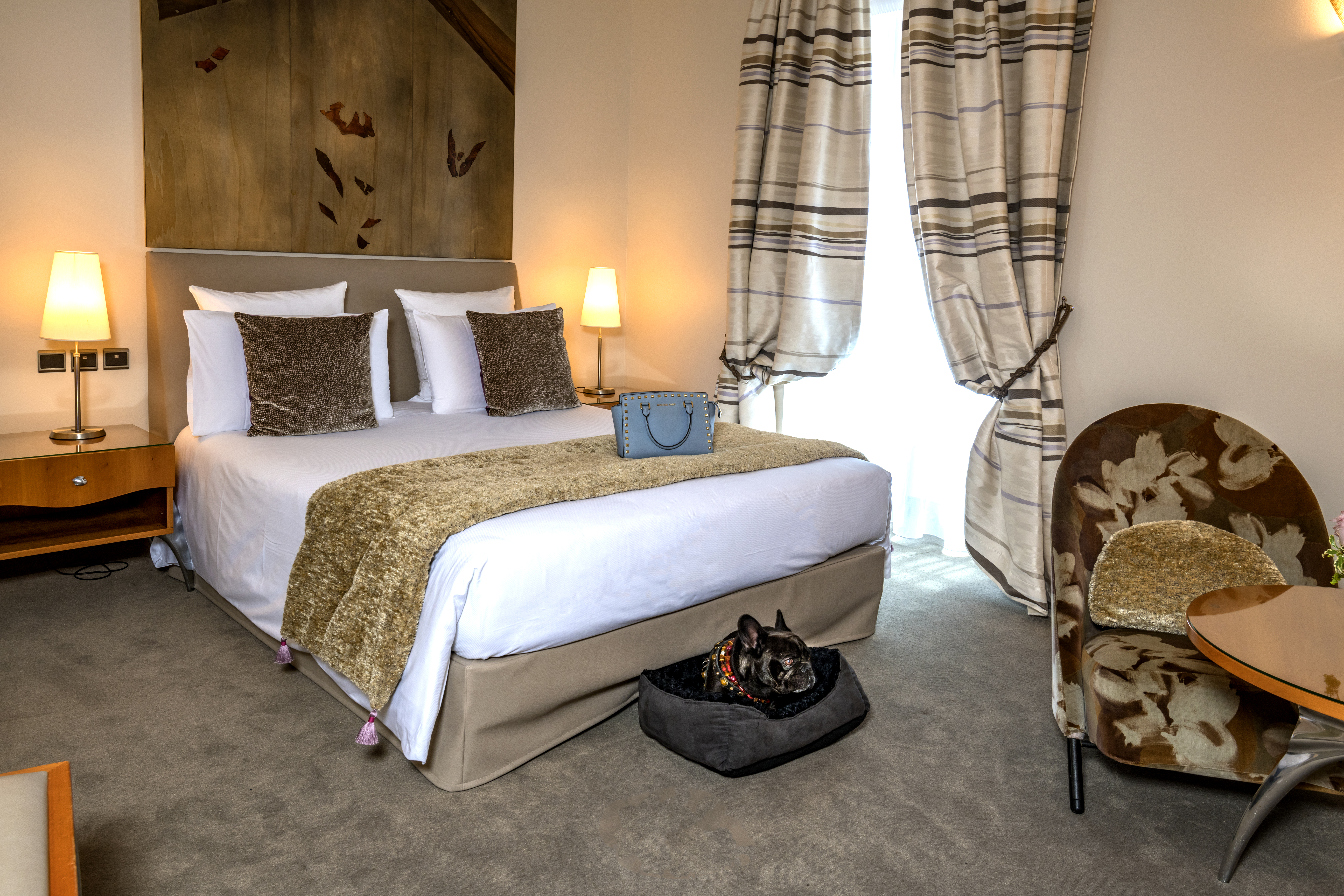 Deluxe bedroom at Regent Petite France creamy brown colours