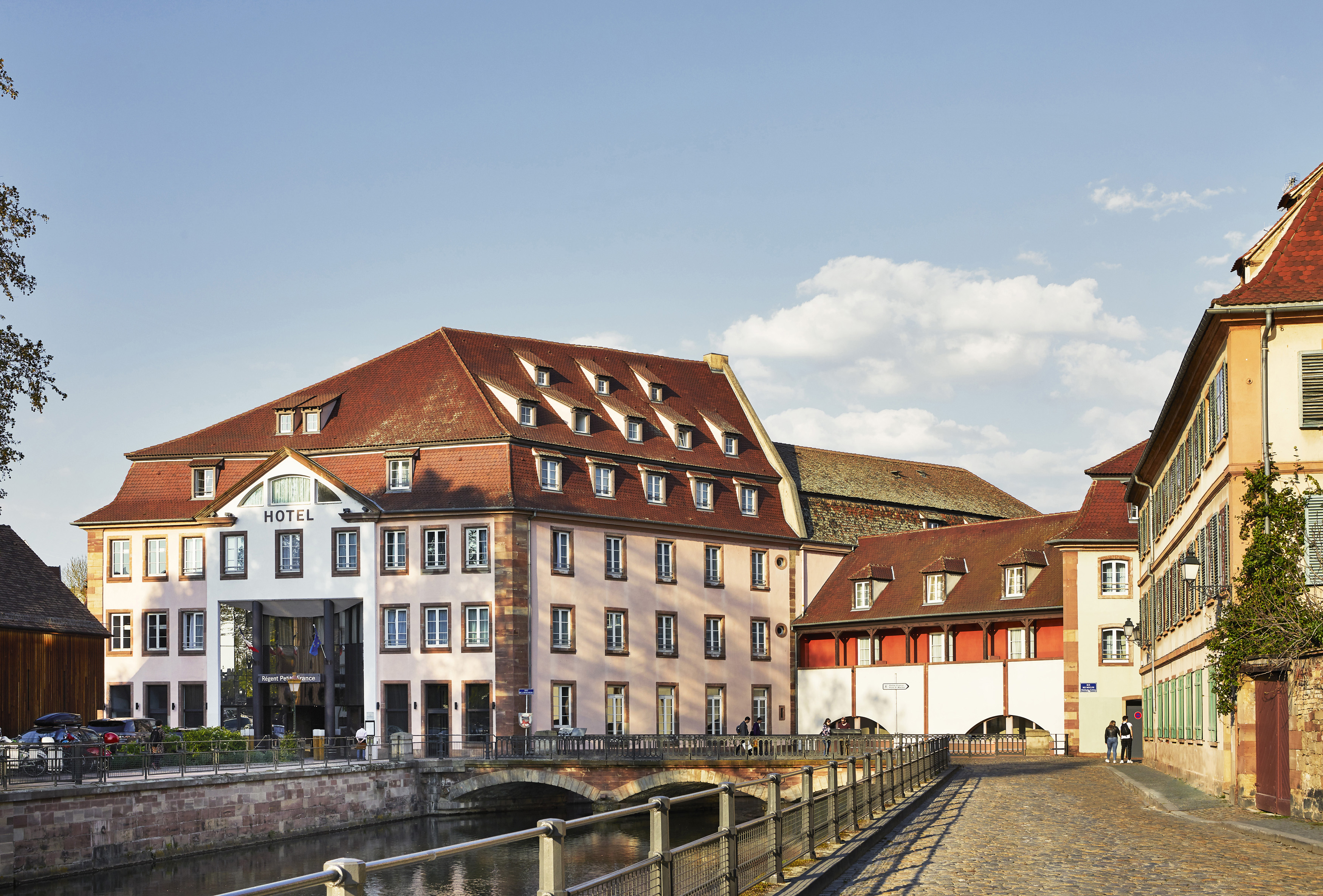 Front of hotel on river with orange roof Regent Petite France