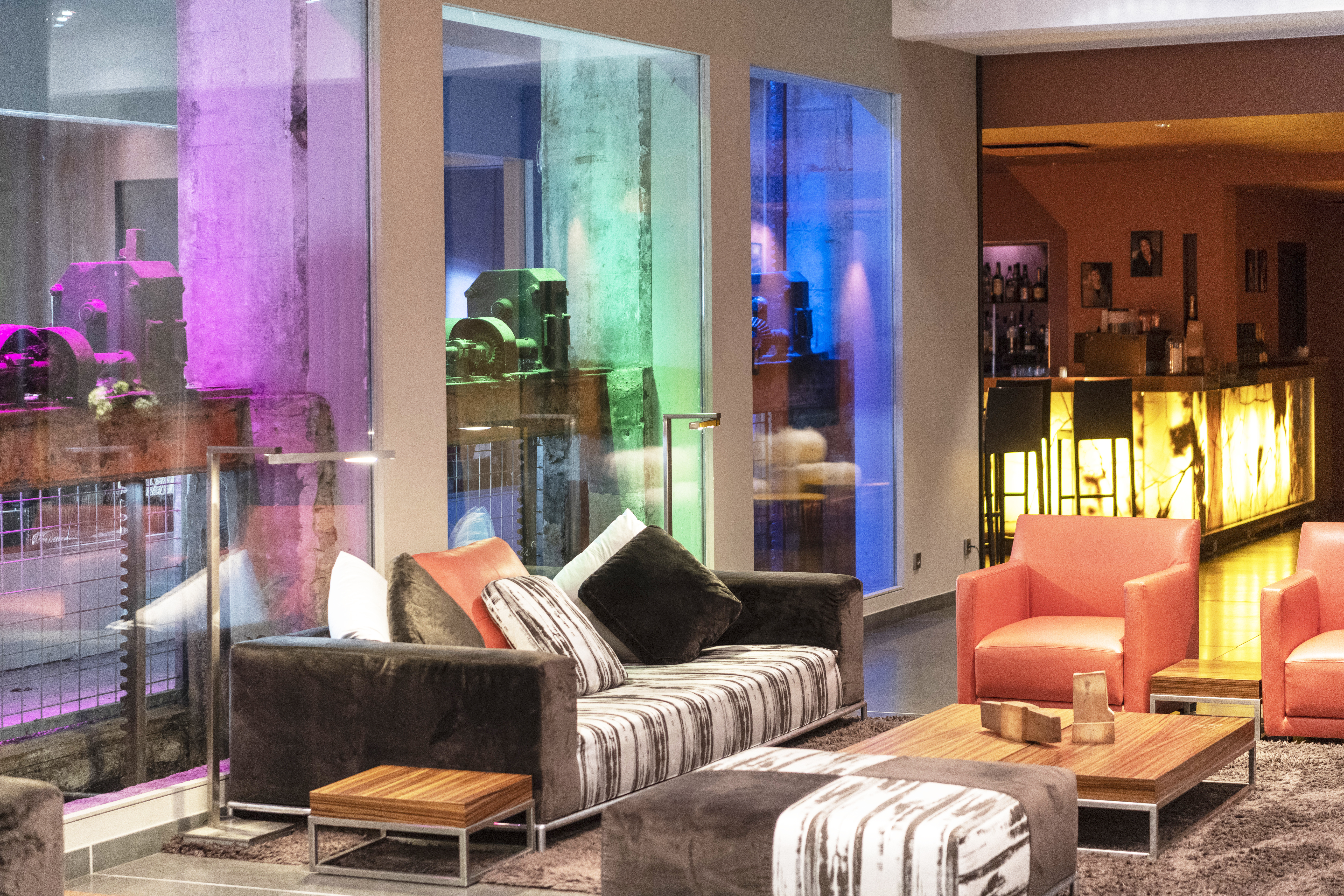 Regent Petite France lobby with lights of different colours and orange chairs