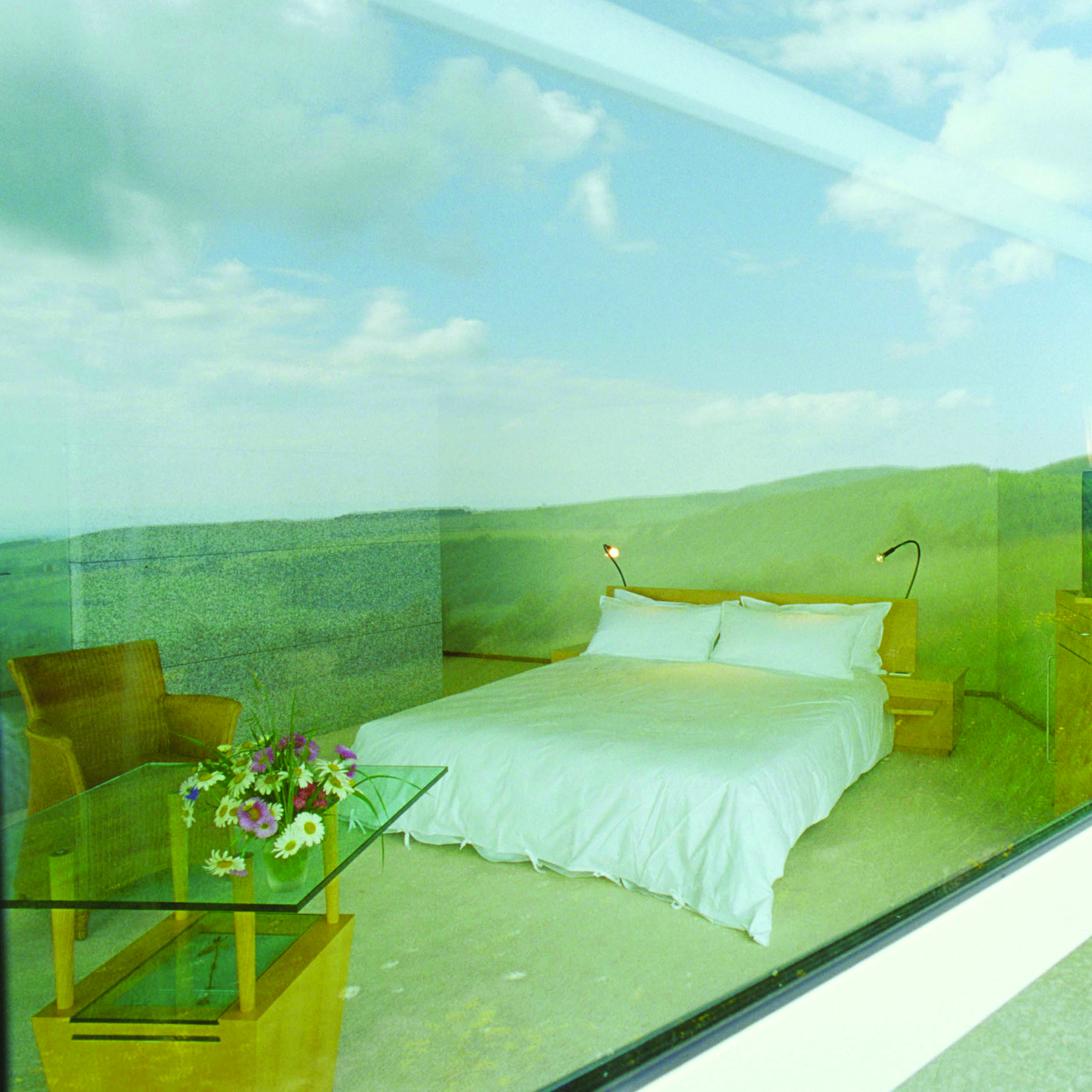 Bras Le Suquet guestroom, double bed, table and chair