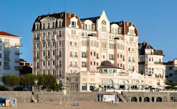 Grand Hotel Basque Country exterior pink building overlooking the beach