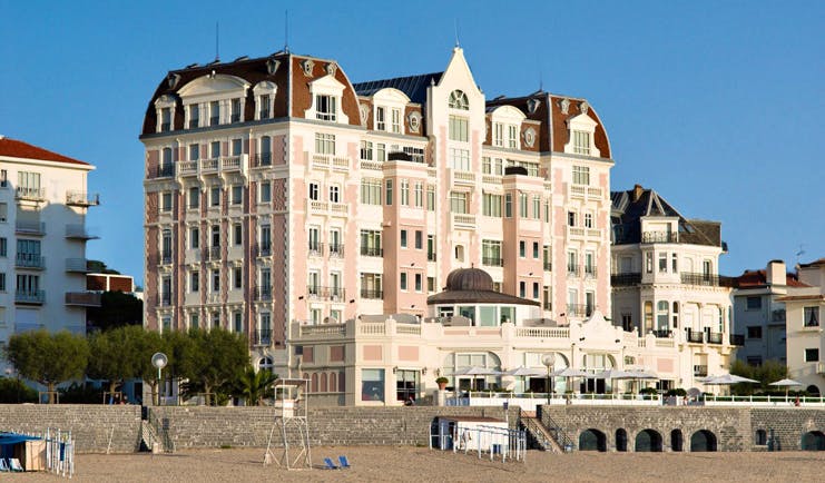 Grand Hotel Basque Country exterior pink building overlooking the beach