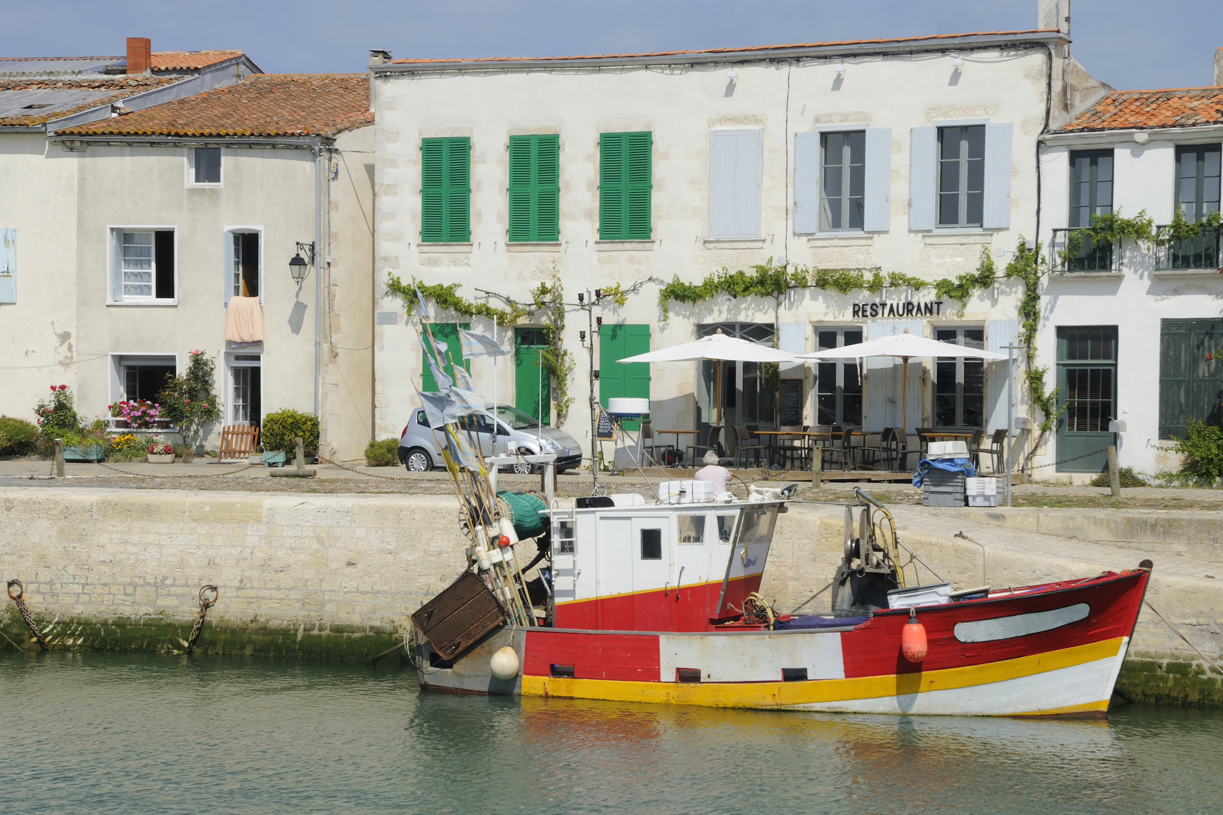 Red and white fishing boat at harbour on Ile de Re