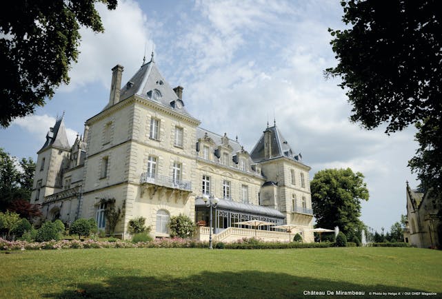 Chateau de Mirambeau hotel building, traditional chateau architecture, terrace, lawns