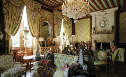 Chateau de Mirambeau lounge, indoor communal seating area, grand traditional decor, chandelier, candlesticks