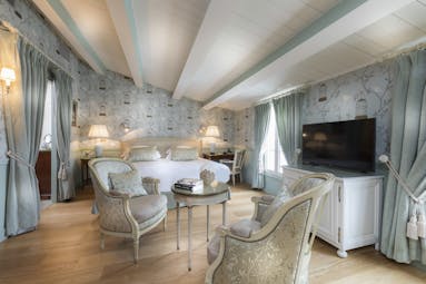 Hotel de Toiras pale blue green bedroom with wooden floor