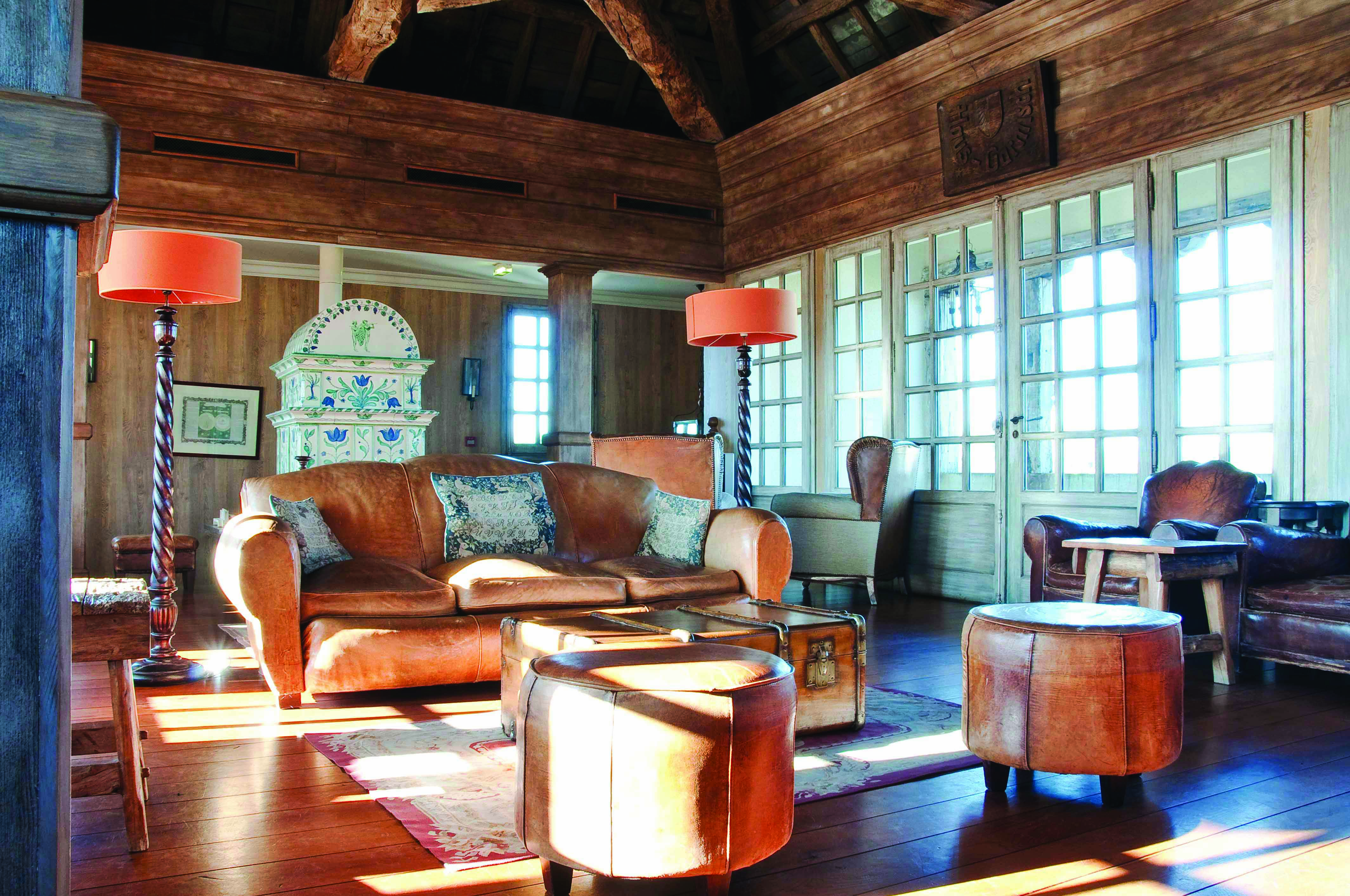 Wood pannelled lounge with old fashioned decor, leather sofas and a grand father clock