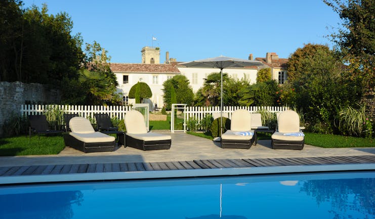 Villa Clarisse chairs next to swimming pool