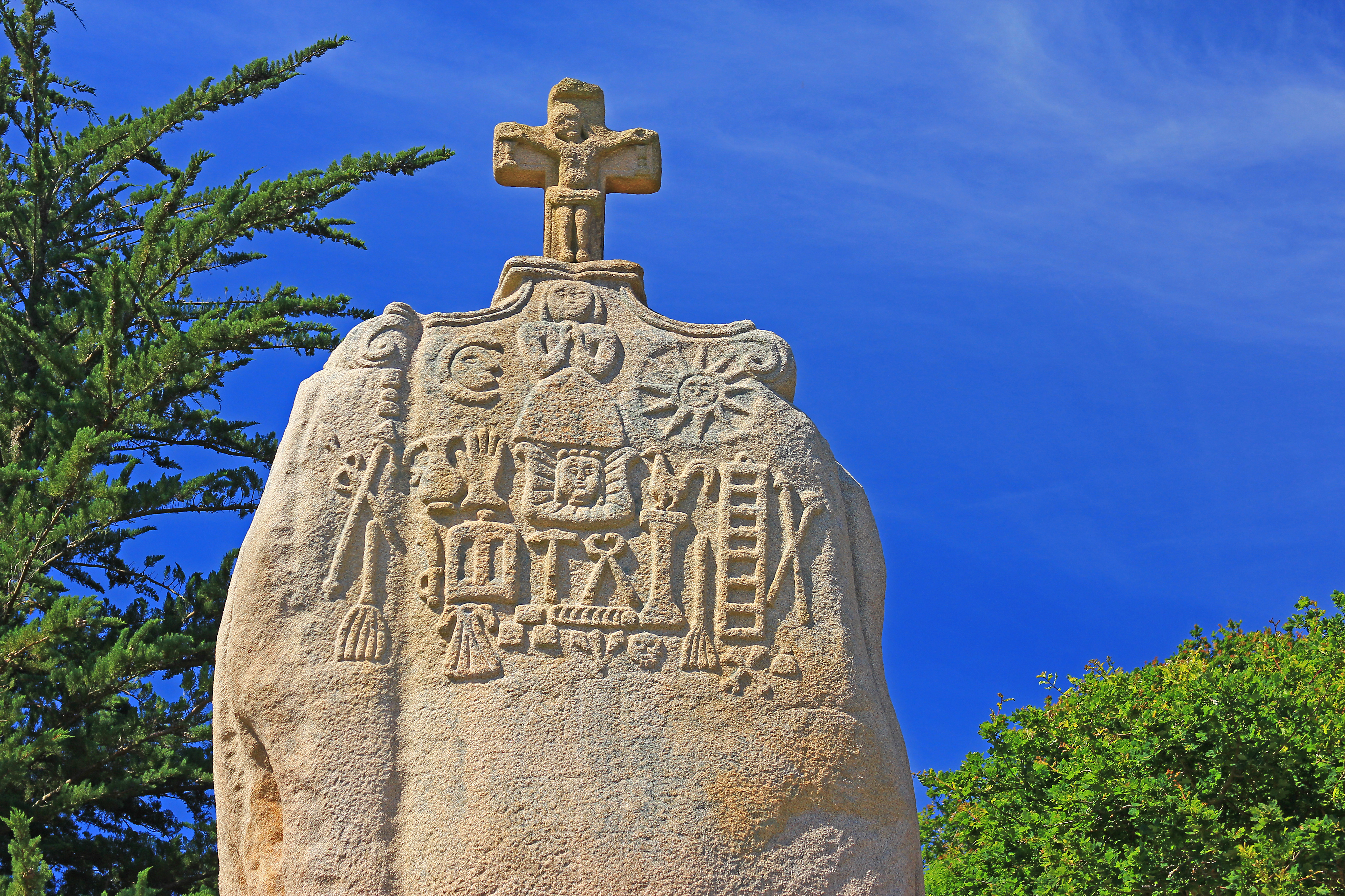 Menhir stone with cross on top in Brittany