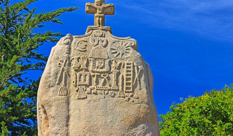Menhir stone with cross on top in Brittany