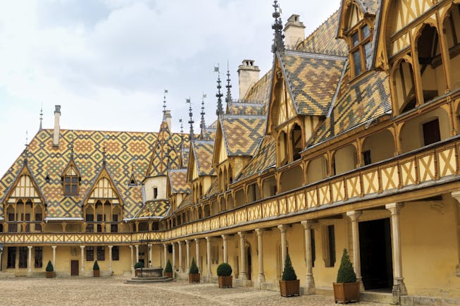Tiled roof and turrets of the Hospices to Beaune in Burgundy