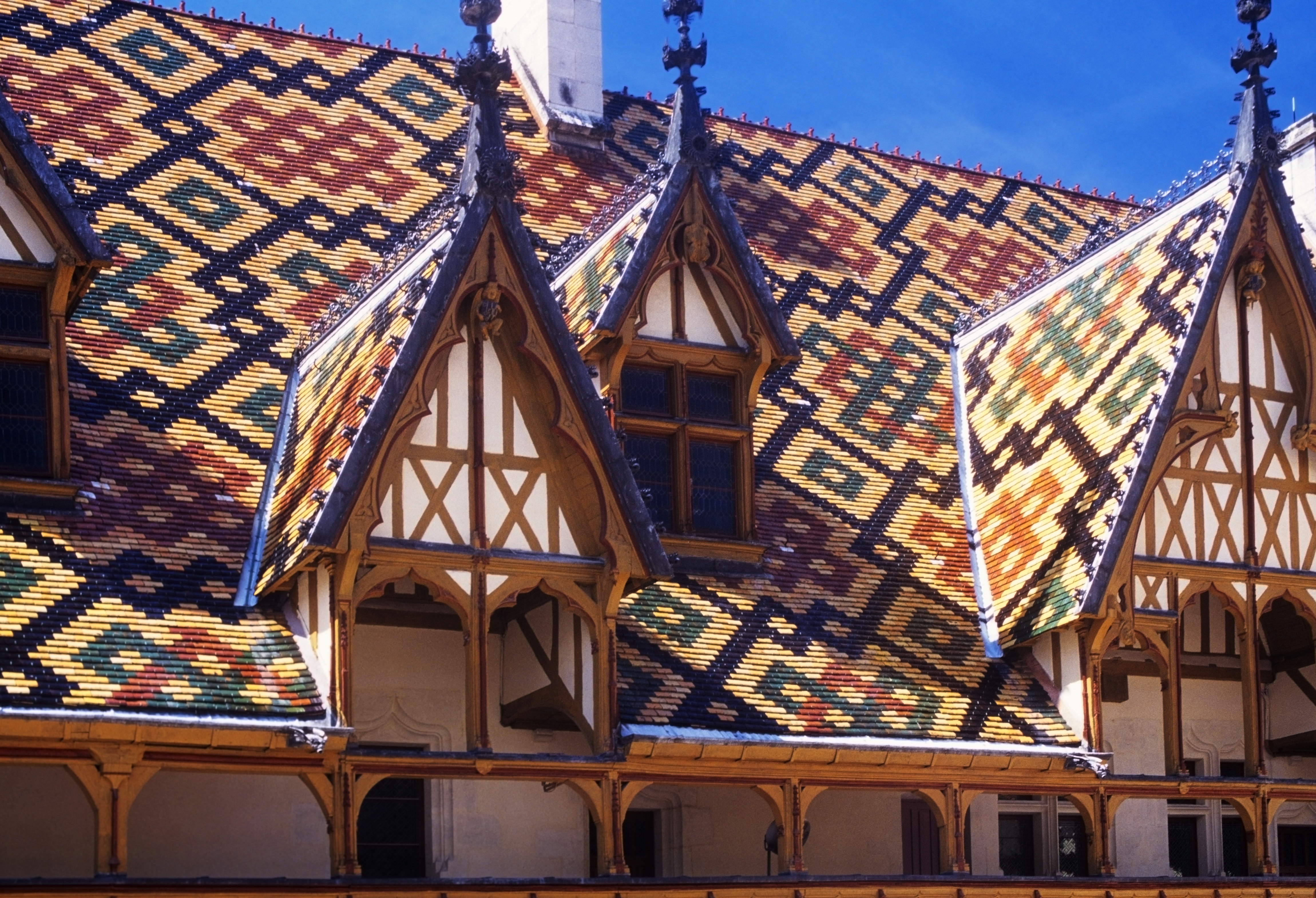 Multi coloured tiles of the roof of the Hospices in Beaune Burgundy