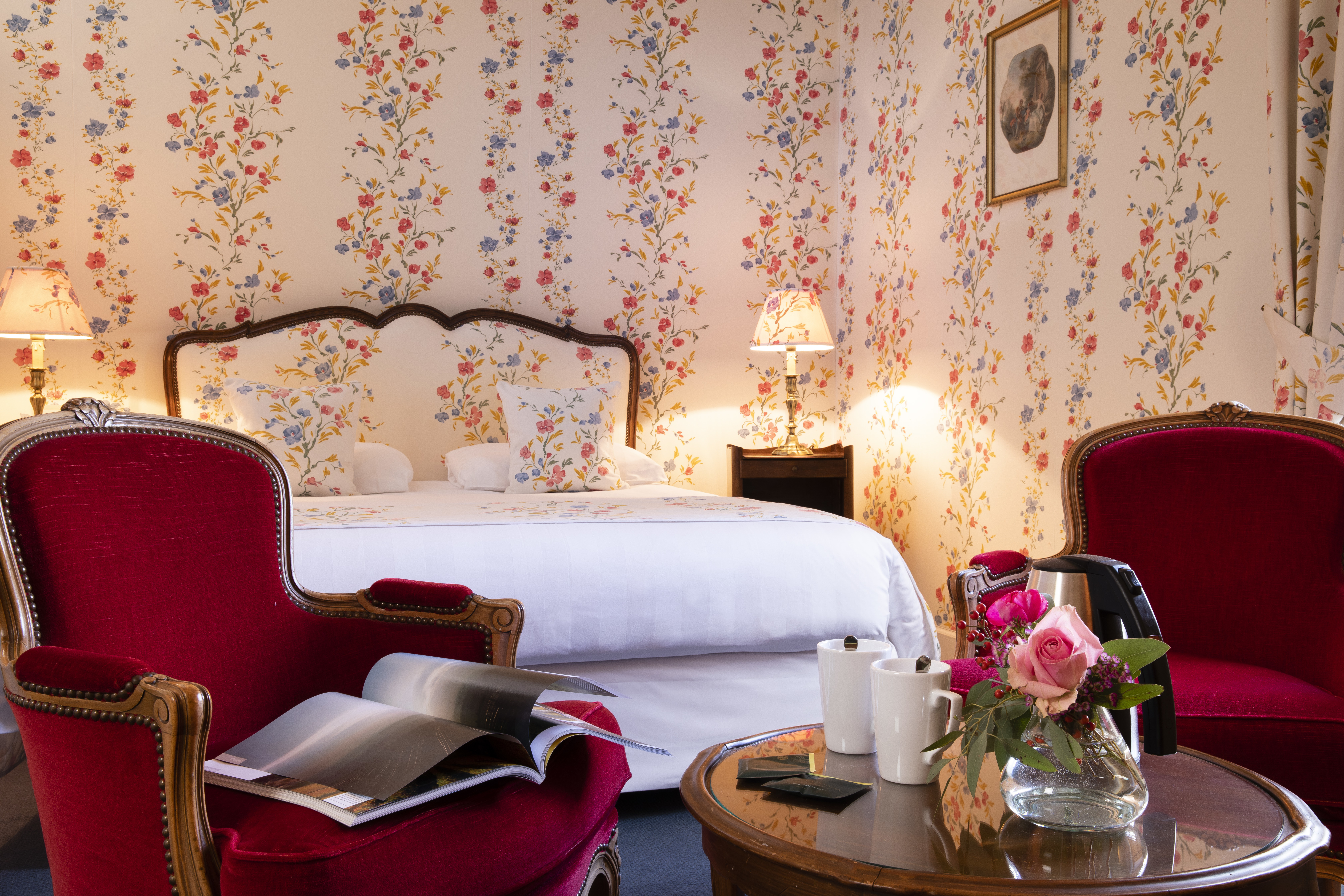 Chateau de Gilly red and white room with roses on table