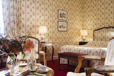 Chateau Gilly Burgundy classic bedroom with yellow and white floral striped wallpaper