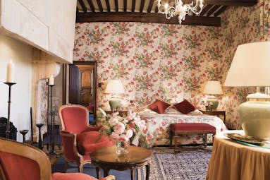  Chateau Gilly Burgundy junior terrace bedroom with floral wallpaper armchairs two bedside tables and lamps