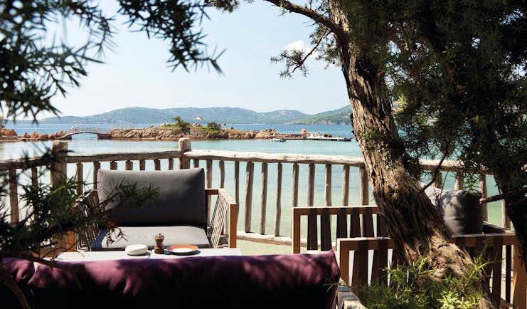 Grand Hotel de Cala Rossa Corsica bar seated terrace area overlooking the beach and small island