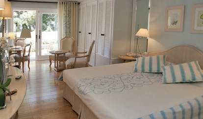 Grand Hotel de Cala Rossa Corsica Lavande bedroom with table and chairs and patio access