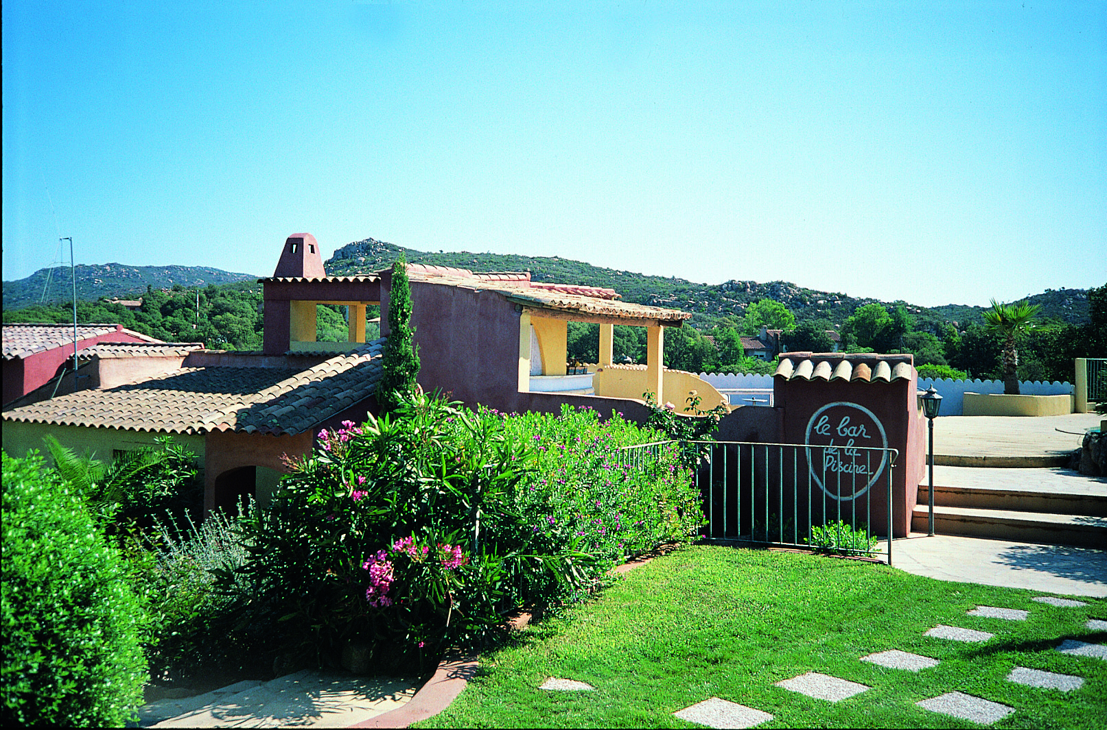Hotel Roc e Fiori exterior, hotel building, gardens, green bushes