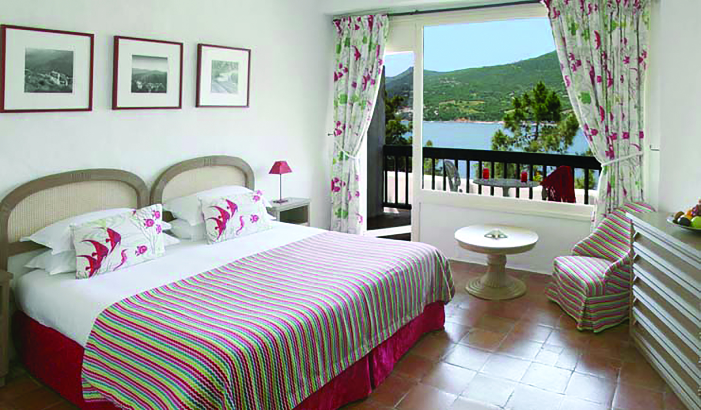 Miramar Boutique Hotel Corsica comfort bedroom tiled floors desk and chair window with sea view