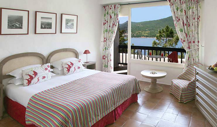 Miramar Boutique Hotel Corsica comfort bedroom tiled floors desk and chair window with sea view