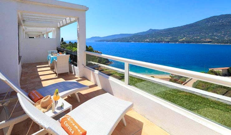 Miramar Boutique Hotel Corsica terrace balcony with sun loungers and sea view